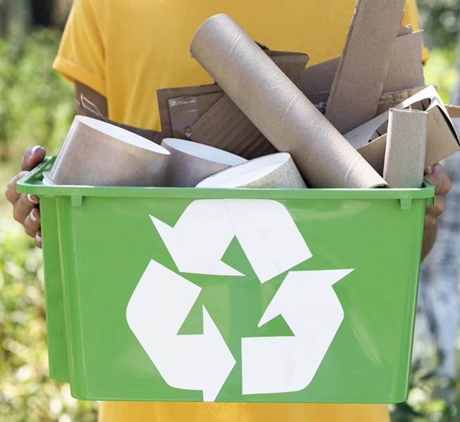 front-view-individual-holding-recycle-produts